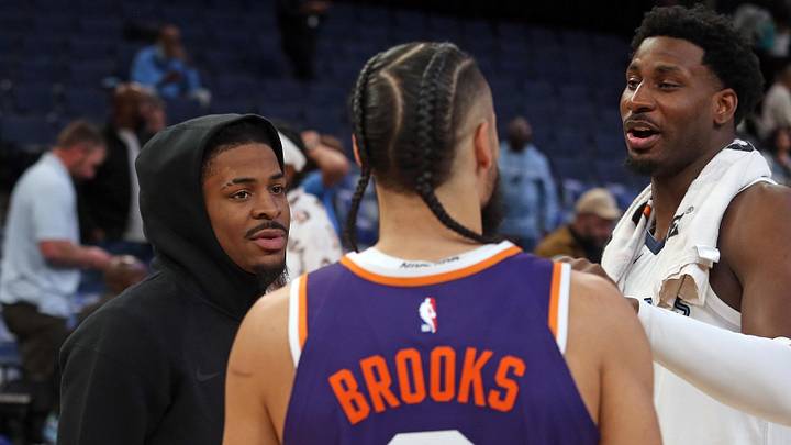 Jan 7, 2026; Memphis, Tennessee, USA; Memphis Grizzlies guard Ja Morant (left) and forward Jaren Jackson Jr. (right) talk with Phoenix Suns forward Dillon Brooks (3) after the game at FedExForum. Mandatory Credit: Petre Thomas-Imagn Images