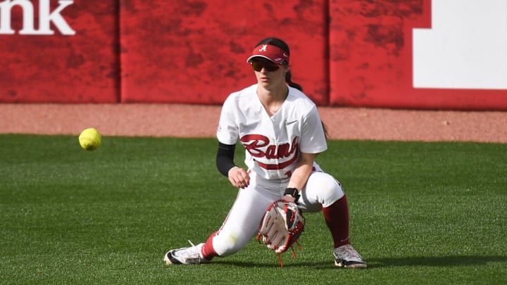 Mar 9, 2024; Tuscaloosa, Alabama, USA; Alabama outfielder Lauren Johnson goes to her knee to field a single hit by a Florida batter at Rhoads Stadium in the opening game of the three game SEC opener. Mar 9, 2024; Tuscaloosa, Alabama, USA; Alabama outfielder Lauren Johnson goes to her knee to field a single hit by a Florida batter at Rhoads Stadium in the opening game of the three game SEC opener.