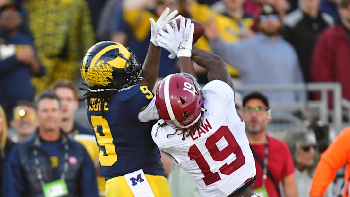 Jan 1, 2024; Pasadena, CA, USA; Alabama Crimson Tide wide receiver Kendrick Law (19) cannot make a catch against Michigan Wolverines defensive back Rod Moore (9) in the second quarter in the 2024 Rose Bowl college football playoff semifinal game at Rose Bowl. Mandatory Credit: Gary A. Vasquez-Imagn Images Jan 1, 2024; Pasadena, CA, USA; Alabama Crimson Tide wide receiver Kendrick Law (19) cannot make a catch against Michigan Wolverines defensive back Rod Moore (9) in the second quarter in the 2024 Rose Bowl college football playoff semifinal game at Rose Bowl. Mandatory Credit: Gary A. Vasquez-Imagn Images