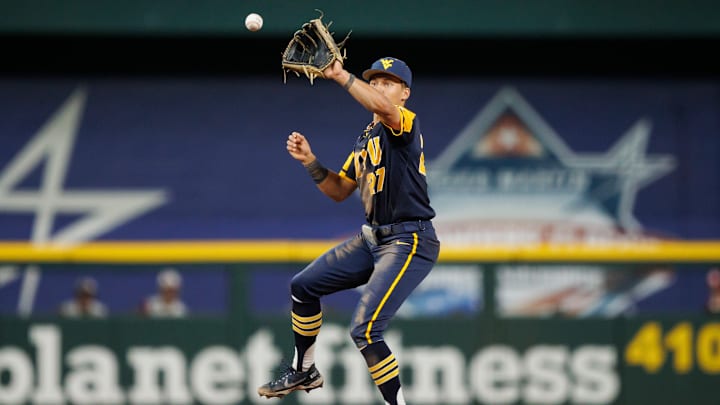 JJ Wetherholt fields the ball for WVU.