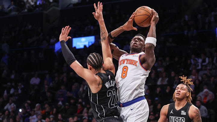 Jan 21, 2025; Brooklyn, New York, USA;  New York Knicks forward OG Anunoby (8) drives past Brooklyn Nets forward Jalen Wilson (22) in the second quarter at Barclays Center. Mandatory Credit: Wendell Cruz-Imagn Images