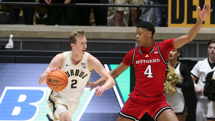 Purdue Boilermakers guard Fletcher Loyer (2) drives past Rutgers Scarlet Knights guard Ace Bailey (4) Tuesday, March 4, 2025, during the NCAA men’s basketball game at Mackey Arena in West Lafayette, Ind.