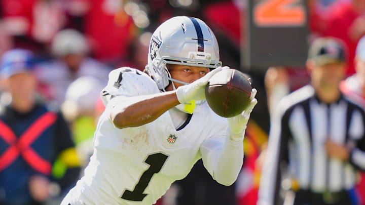 Oct 19, 2025; Kansas City, Missouri, USA; Las Vegas Raiders wide receiver Tre Tucker (1) makes a reception against the Kansas City Chiefs during the third quarter of the game at GEHA Field at Arrowhead Stadium. Mandatory Credit: Jay Biggerstaff-Imagn Images