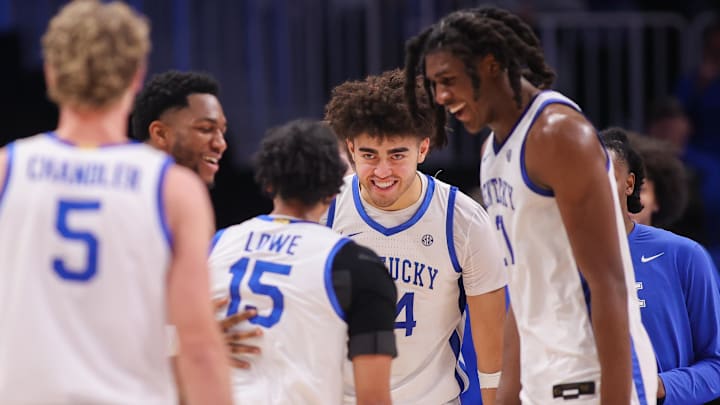 Dec 20, 2025; Atlanta, Georgia, USA; Kentucky Wildcats guard Jaland Lowe (15) reacts with center Malachi Moreno (24) and forward Jayden Quaintance (21) against the St. John Red Storm in the second half at State Farm Arena. Mandatory Credit: Brett Davis-Imagn Images
