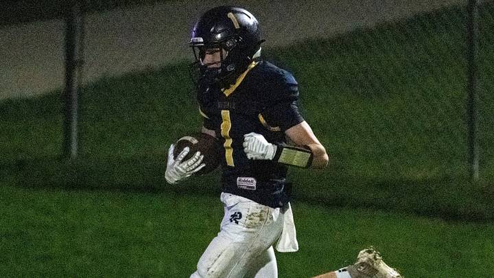 Regina's Holt Hinkel (1) beats the last defends to return a Sigourney Keota punt for a touchdown Oct. 2, 2026 during a high school football game in Iowa City, Iowa.