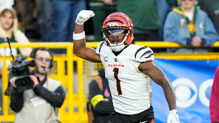 Oct 12, 2025; Green Bay, Wisconsin, USA; Cincinnati Bengals wide receiver Ja'Marr Chase (1) reacts after scoring a touchdown in the fourth quarter against the Green Bay Packers at Lambeau Field. Mandatory Credit: Kayla Wolf-Imagn Images