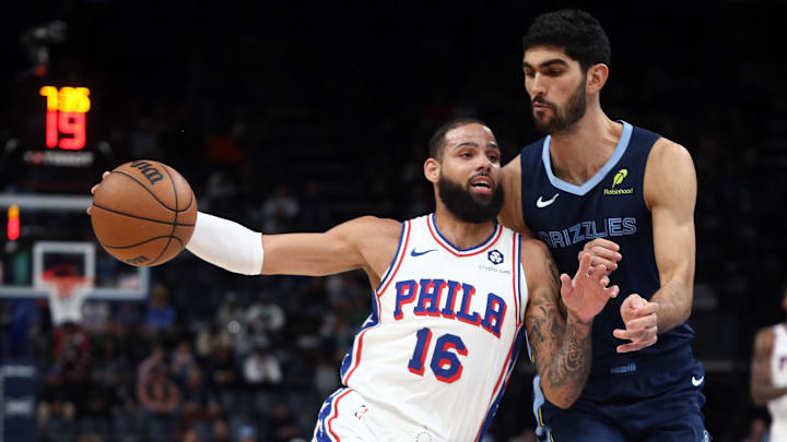 Nov 20, 2024; Memphis, Tennessee, USA; Philadelphia 76ers forward Caleb Martin (16) drives to the basket as Memphis Grizzlies forward Santi Aldama (7) defends during the first half at FedExForum. Mandatory Credit: Petre Thomas-Imagn Images