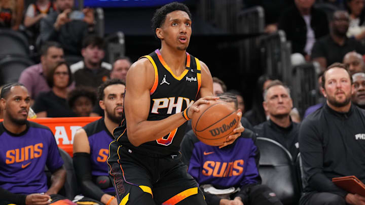 Mar 21, 2025; Phoenix, Arizona, USA; Phoenix Suns forward Ryan Dunn (0) shoots against the Cleveland Cavaliers during the second half at Footprint Center. Mandatory Credit: Joe Camporeale-Imagn Images