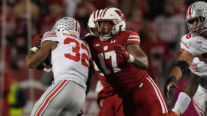 Wisconsin linebacker Darryl Peterson (17) tackles Ohio State running back TreVeyon Henderson (32) during the third quarter of their game Saturday, October 28, 2023 at Camp Randall Stadium in Madison, Wisconsin. Ohio State beat Wisconsin 24-10.