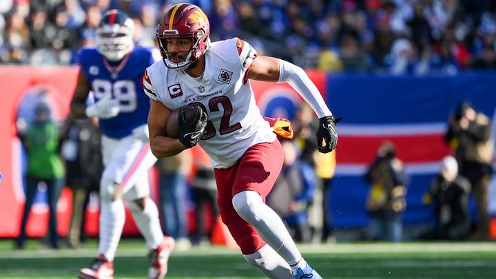 Dec 4, 2022; East Rutherford, New Jersey, USA; Washington Commanders tight end Logan Thomas (82) runs with the ball after a catch against the New York Giants during the first half at MetLife Stadium. Mandatory Credit: Rich Barnes-Imagn Images