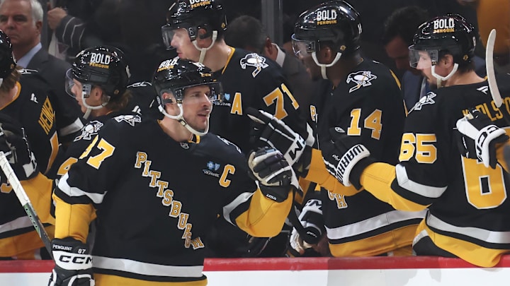 Mar 11, 2025; Pittsburgh, Pennsylvania, USA;  Pittsburgh Penguins center Sidney Crosby (87) celebrates his second goal of the game with the Penguins bench against the Vegas Golden Knights during the second period at PPG Paints Arena. Mandatory Credit: Charles LeClaire-Imagn Images