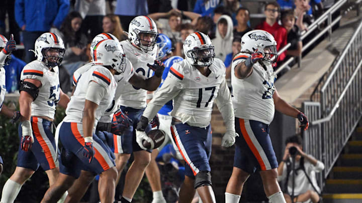 Nov 15, 2025; Durham, North Carolina, USA;  Virginia Cavaliers defensive end Mitchell Melton (17) reacts after recovering a fumble against the Duke Blue Devils during the third quarter at Wallace Wade Stadium. Mandatory Credit: Zachary Taft-Imagn Images