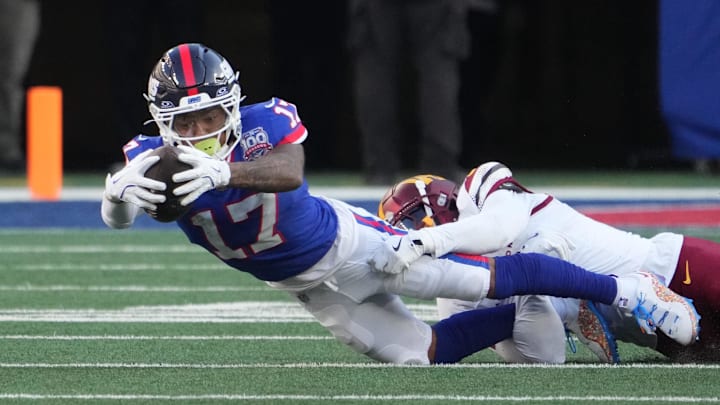 New York Giants wide receiver Wan'Dale Robinson (17) reaches for a 2nd half 1st down against the Washington Commanders at MetLife Stadium. New York Giants wide receiver Wan'Dale Robinson (17) reaches for a 2nd half 1st down against the Washington Commanders at MetLife Stadium.