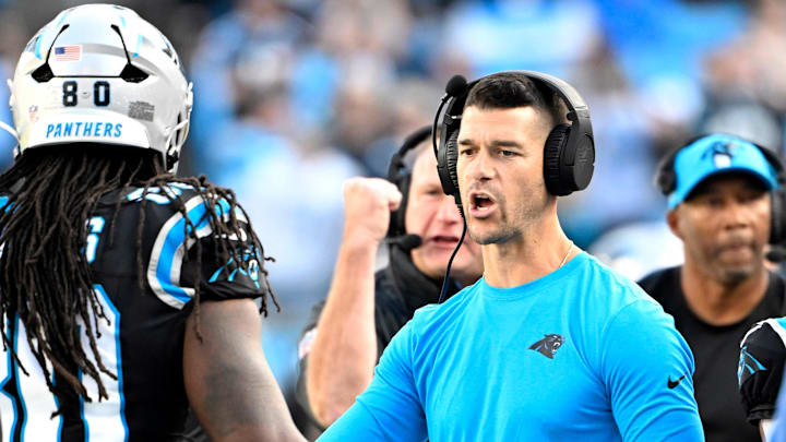 Nov 3, 2024; Charlotte, North Carolina, USA; Carolina Panthers head coach Dave Canales with Ian Thomas (80) in the third qarter at Bank of America Stadium. Mandatory Credit: Bob Donnan-Imagn Images