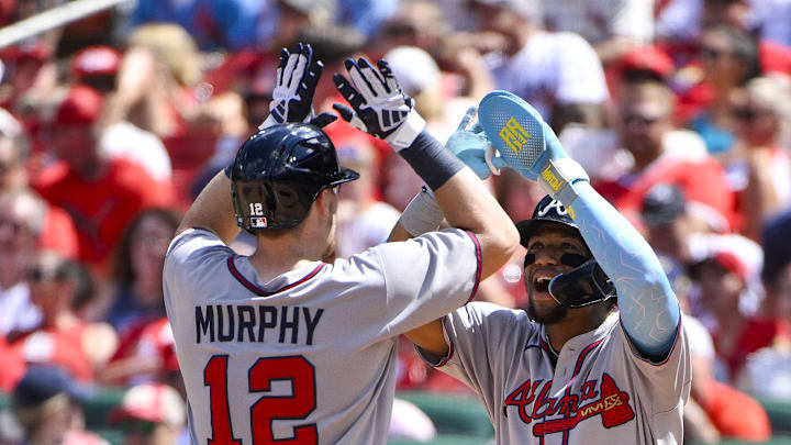 Jul 12, 2025; St. Louis, Missouri, USA;  Atlanta Braves catcher Sean Murphy (12) celebrates with right fielder Ronald Acuna Jr (13) after hitting a go ahead three run home run against the St. Louis Cardinals during the eighth inning at Busch Stadium. Mandatory Credit: Jeff Curry-Imagn Images