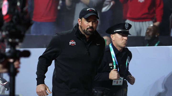 Dec 6, 2025; Indianapolis, IN, USA; Ohio State Buckeyes head coach Ryan Day runs on field before the 2025 Big Ten championship game against the Indiana Hoosiers at Lucas Oil Stadium. Mandatory Credit: Trevor Ruszkowski-Imagn Images