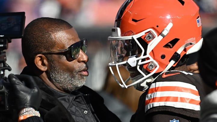 Dec 21, 2025; Cleveland, Ohio, USA;  Cleveland Browns quarterback Shedeur Sanders (12) and his father Deion Sanders on the sidelines prior to a game against the Buffalo Bills at Huntington Bank Field. Mandatory Credit: Ken Blaze-Imagn Images