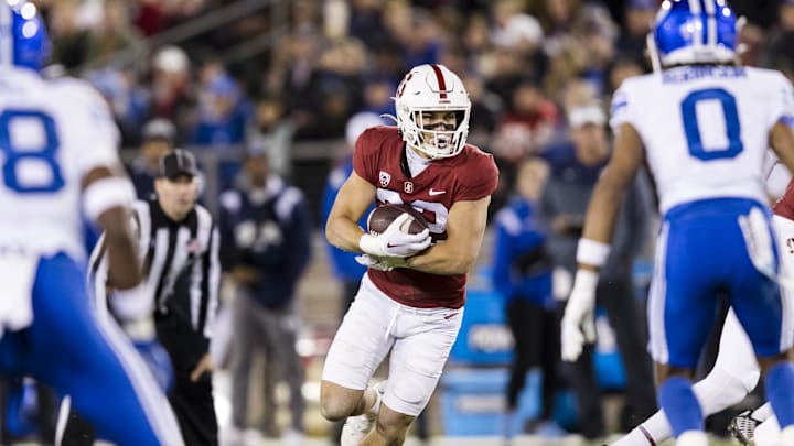 Nov 26, 2022; Stanford, California, USA;  Stanford Cardinal running back Mitch Leigber (32) runs the ball against the Brigham Young Cougars during the first half at Stanford Stadium. Mandatory Credit: John Hefti-Imagn Images