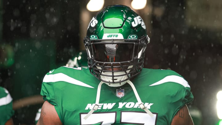 Dec 10, 2023; East Rutherford, New Jersey, USA; New York Jets offensive tackle Mekhi Becton (77) enter the field  before the game against the Houston Texans at MetLife Stadium. Vincent Carchietta-USA TODAY Sports