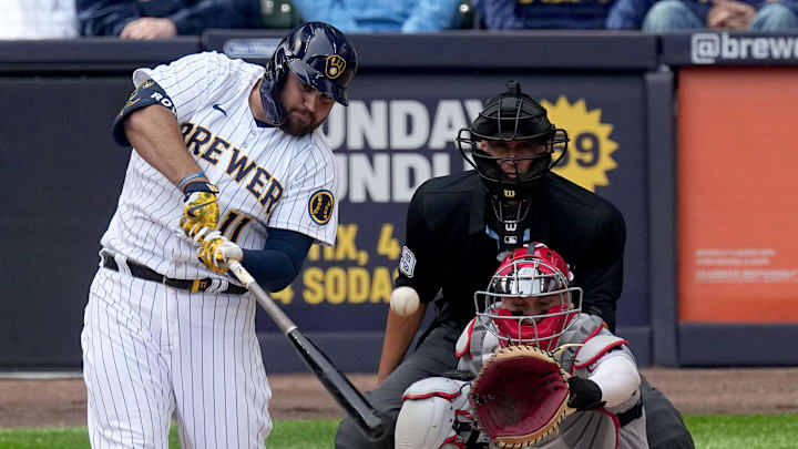 Milwaukee Brewers first baseman Rowdy Tellez (11) hits a two-run double during the seventh  inning of their game against the St. Louis Cardinals Sunday, April 9, 2023 at American Family Field in Milwaukee, Wis