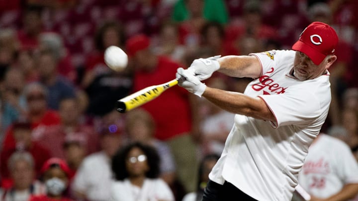 Former Reds player Sean Casey (21) makes contact during the Reds Legends softball game between Team Bench and Team Larkin involving former Reds players as part of the 2021 Reds Hall of Fame induction ceremony for Marty Brennaman on Friday, Aug. 27, 2021, at Great American Ball Park in Cincinnati.