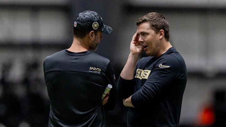 May 10, 2025; New Orleans, LA, USA;  New Orleans Saints head coach Kellen Moore talks with defensive coordinator Brandon Staley during rookie minicamp at Ochsner Sports Performance Center. Mandatory Credit: Stephen Lew-Imagn Images