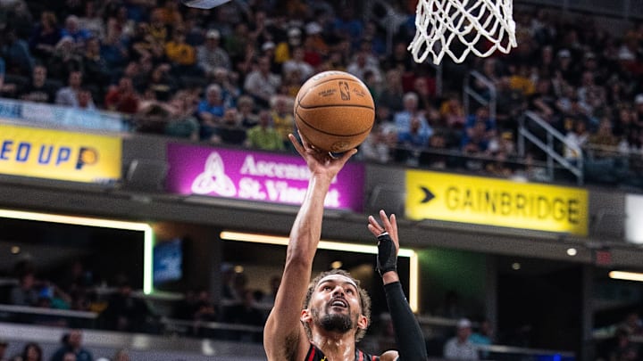 Apr 14, 2024; Indianapolis, Indiana, USA; Atlanta Hawks guard Trae Young (11) shoots the ball in the second half against the Indiana Pacers at Gainbridge Fieldhouse. Mandatory Credit: Trevor Ruszkowski-USA TODAY Sports