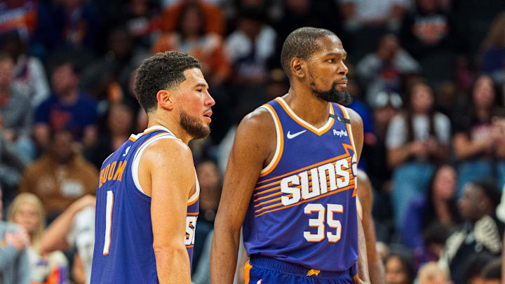 Nov 2, 2024; Phoenix, Arizona, USA;  Phoenix Suns guard Devin Booker (1) and forward Kevin Durant (35) react after a time out late in the second half during a game against the Portland Trail Blazers at Footprint Center. Mandatory Credit: Allan Henry-Imagn Images