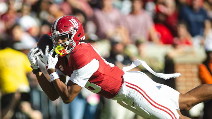Nov 16, 2024; Tuscaloosa, Alabama, USA; Alabama Crimson Tide wide receiver Caleb Odom (18) dives in an attempt to complete a pass agains the Mercer Bears during the first quarter at Bryant-Denny Stadium. Mandatory Credit: Will McLelland-Imagn Images