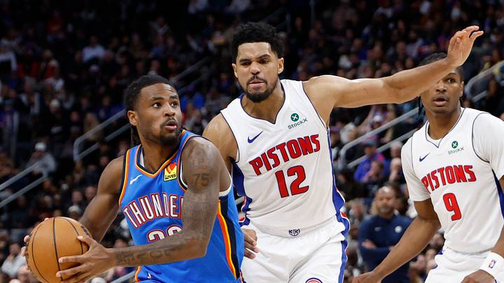 Feb 25, 2026; Detroit, Michigan, USA;  Oklahoma City Thunder guard Cason Wallace (22) dribbles defended by Detroit Pistons forward Tobias Harris (12) in the second half at Little Caesars Arena. Mandatory Credit: Rick Osentoski-Imagn Images