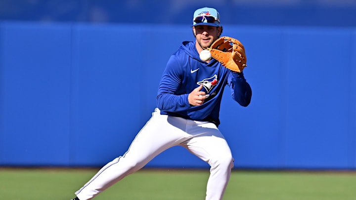 Blue Jays utility man Ernie Clement fields a ground ball during spring training at Bobby Mattick Training Center at Englebert Complex. Blue Jays utility man Ernie Clement fields a ground ball during spring training at Bobby Mattick Training Center at Englebert Complex.