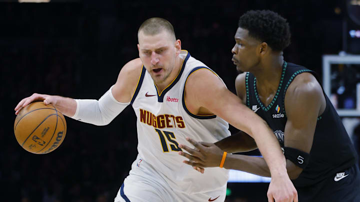 Apr 23, 2026; Minneapolis, Minnesota, USA; Denver Nuggets center Nikola Jokic (15) works around Minnesota Timberwolves guard Anthony Edwards (5) in the third quarter at Target Center.