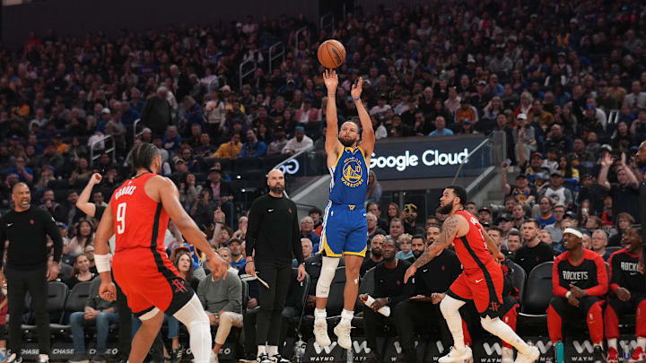 Apr 6, 2025; San Francisco, California, USA; Golden State Warriors guard Stephen Curry (30) shoots over Houston Rockets guard Fred VanVleet (5) in the first quarter at the Chase Center. Mandatory Credit: Cary Edmondson-Imagn Images