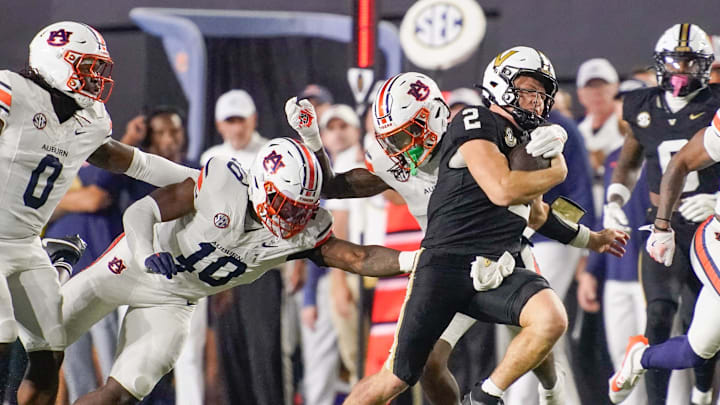 Auburn safety Kaleb Harris (8) gets ahold of Vanderbilt quarterback Diego Pavia (2) during the third quarter at FirstBank Stadium in Nashville, Tenn., Saturday, Nov. 8, 2025.