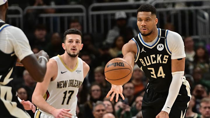 Apr 10, 2025; Milwaukee, Wisconsin, USA; Milwaukee Bucks forward Giannis Antetokounmpo (34) passes the ball away from New Orleans Pelicans forward Karlo Matkovic (17) in the second quarter at Fiserv Forum. Mandatory Credit: Benny Sieu-Imagn Images