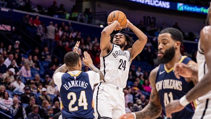 Jan 14, 2026; New Orleans, Louisiana, USA;  Brooklyn Nets guard Cam Thomas (24) shoots a jump shot against New Orleans Pelicans guard Jordan Hawkins (24) during the first half at Smoothie King Center. Mandatory Credit: Stephen Lew-Imagn Images