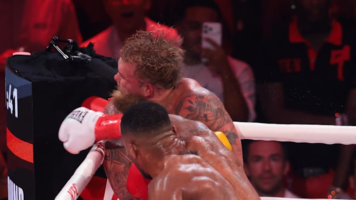 Jake Paul is knocked down by Anthony Joshua.