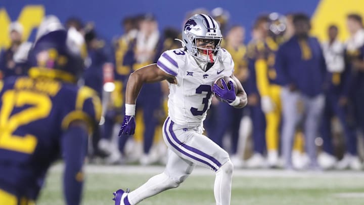 Oct 19, 2024; Morgantown, West Virginia, USA; Kansas State Wildcats running back Dylan Edwards (3) runs during the fourth quarter against the West Virginia Mountaineers at Mountaineer Field at Milan Puskar Stadium. Mandatory Credit: Ben Queen-Imagn Images