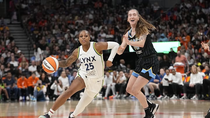 May 13, 2023; Toronto, Ontario, Canada; Minnesota Lynx guard Tiffany Mitchell (25) drives past Chicago Sky forward Anneli Maley (15) during the second half at Scotiabank Arena. Mandatory Credit: John E. Sokolowski-Imagn Images