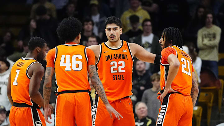 Feb 21, 2026; Boulder, Colorado, USA; Oklahoma State Cowboys center Parsa Fallah (22) huddles his teammates in the second half against the Colorado Buffaloes at the CU Events Center. Mandatory Credit: Ron Chenoy-Imagn Images