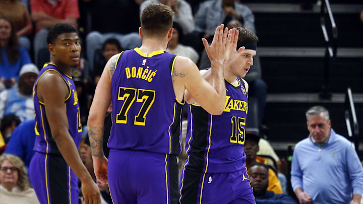 Mar 29, 2025; Memphis, Tennessee, USA; Los Angeles Lakers guard Austin Reaves (15) reacts with guard Luka Doncic (77) after a basket during the fourth quarter against the Memphis Grizzlies at FedExForum. Mandatory Credit: Petre Thomas-Imagn Images Mar 29, 2025; Memphis, Tennessee, USA; Los Angeles Lakers guard Austin Reaves (15) reacts with guard Luka Doncic (77) after a basket during the fourth quarter against the Memphis Grizzlies at FedExForum. Mandatory Credit: Petre Thomas-Imagn Images