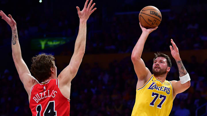 Mar 12, 2026; Los Angeles, California, USA; Los Angeles Lakers guard Luka Doncic (77) shoots against Chicago Bulls forward Matas Buzelis (14) during the first half at Crypto.com Arena. Mandatory Credit: Gary A. Vasquez-Imagn Images Mar 12, 2026; Los Angeles, California, USA; Los Angeles Lakers guard Luka Doncic (77) shoots against Chicago Bulls forward Matas Buzelis (14) during the first half at Crypto.com Arena. Mandatory Credit: Gary A. Vasquez-Imagn Images
