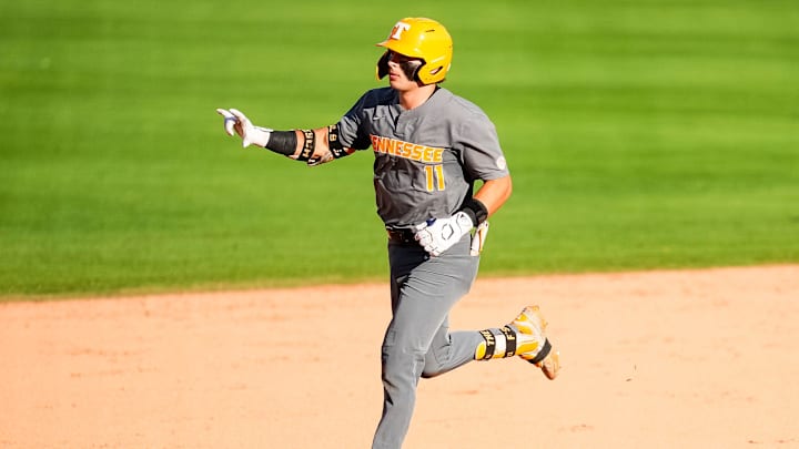 Tennessee's Andrew Fischer (11) gestures as he rounds the bases after hitting a home run during game one of the NCAA baseball tournament Fayetteville Super Regional between Tennessee and Arkansas held at Baum-Walker Stadium on Saturday, June 7, 2025.