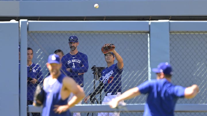 May 21, 2025; Los Angeles, California, USA;  Los Angeles Dodgers designated hitter Shohei Ohtani (17) throws in the bullpen prior to the game against the Arizona Diamondbacks at Dodger Stadium. Mandatory Credit: Jayne Kamin-Oncea-Imagn Images