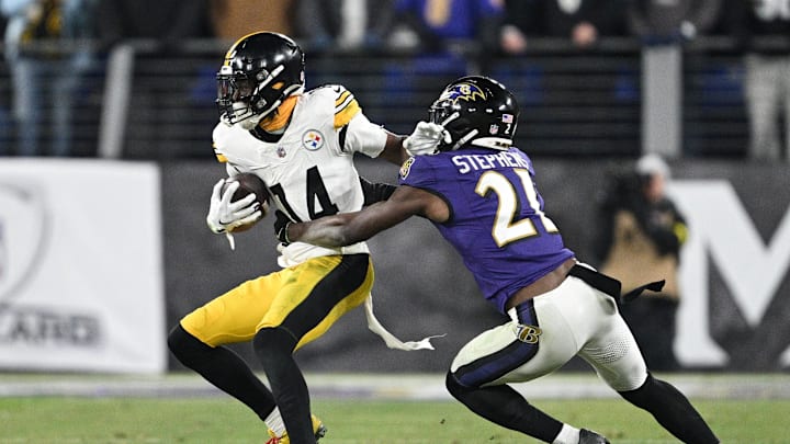 Jan 11, 2025; Baltimore, Maryland, USA; Pittsburgh Steelers wide receiver George Pickens (14) runs against Baltimore Ravens cornerback Brandon Stephens (21) in the fourth quarter in an AFC wild card game at M&T Bank Stadium. Mandatory Credit: Tommy Gilligan-Imagn Images Jan 11, 2025; Baltimore, Maryland, USA; Pittsburgh Steelers wide receiver George Pickens (14) runs against Baltimore Ravens cornerback Brandon Stephens (21) in the fourth quarter in an AFC wild card game at M&T Bank Stadium. Mandatory Credit: Tommy Gilligan-Imagn Images