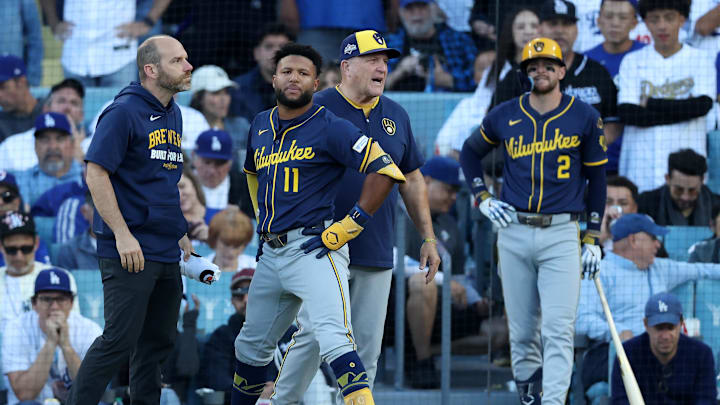 Oct 16, 2025; Los Angeles, California, USA; Milwaukee Brewers center fielder Jackson Chourio (11) is rendered aid by medical staff in the seventh inning during game three of the NLCS round for the 2025 MLB playoffs at Dodger Stadium. Mandatory Credit: Kiyoshi Mio-Imagn Images Oct 16, 2025; Los Angeles, California, USA; Milwaukee Brewers center fielder Jackson Chourio (11) is rendered aid by medical staff in the seventh inning during game three of the NLCS round for the 2025 MLB playoffs at Dodger Stadium. Mandatory Credit: Kiyoshi Mio-Imagn Images