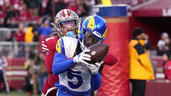 Jan 7, 2024; Santa Clara, California, USA; Los Angeles Rams wide receiver Tutu Atwell (5) catches a pass for a two-point conversion against San Francisco 49ers safety Tayler Hawkins (back) during the fourth quarter at Levi's Stadium. Mandatory Credit: Darren Yamashita-Imagn Images