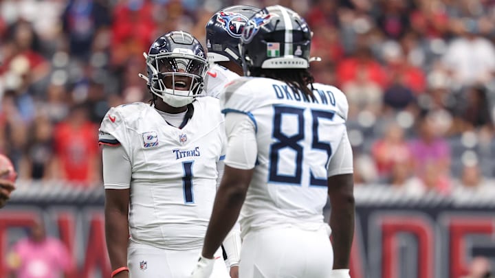 Sep 28, 2025; Houston, Texas, USA; Tennessee Titans quarterback Cam Ward (1) reacts after a play during the first half against the Houston Texans at NRG Stadium. Mandatory Credit: Troy Taormina-Imagn Images