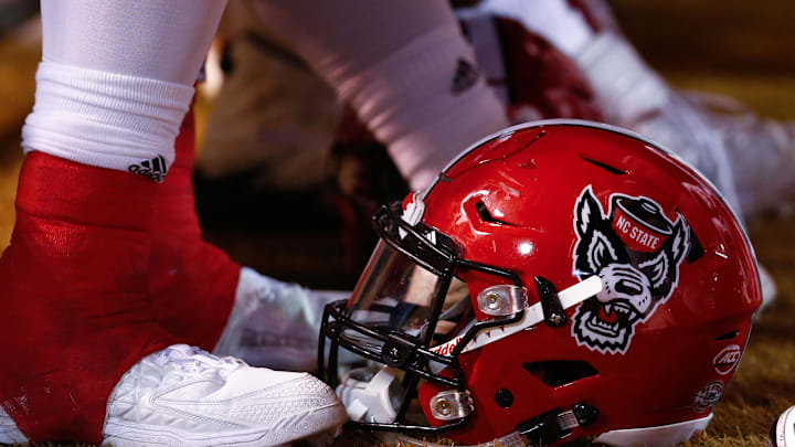 Nov 18, 2017; Winston-Salem, NC, USA; A North Carolina State Wolfpack helmet lays on the sidelines during the game against the Wake Forest Demon Deacons at BB&T Field. Mandatory Credit: Jeremy Brevard-Imagn Images Nov 18, 2017; Winston-Salem, NC, USA; A North Carolina State Wolfpack helmet lays on the sidelines during the game against the Wake Forest Demon Deacons at BB&T Field. Mandatory Credit: Jeremy Brevard-Imagn Images