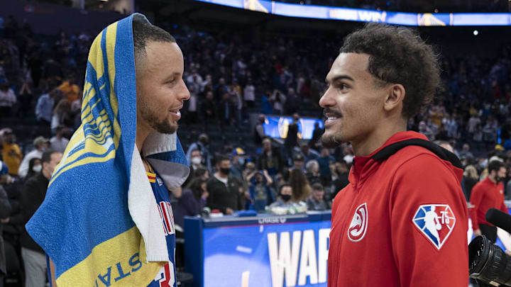 November 8, 2021; San Francisco, California, USA; Golden State Warriors guard Stephen Curry (30) and Atlanta Hawks guard Trae Young (11) talk after the game at Chase Center. Mandatory Credit: Kyle Terada-Imagn Images